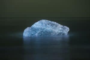 Iceberg In Sea Against Clear Sky